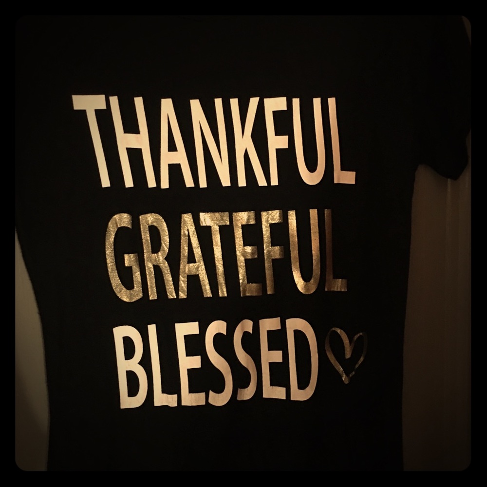 Large shirts with gold lettering.